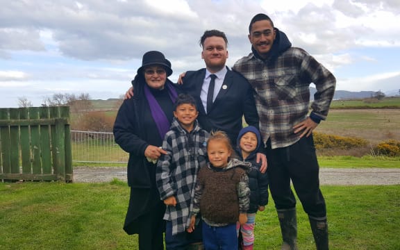 Ramari Nepia, left, Callum Phillips,centre, and whānau.