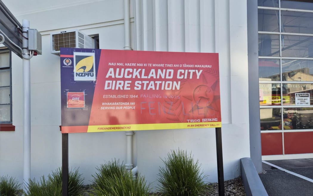 A sign Auckland City Fire Station is changed to read 'Dire Station' as firefighters have complained of fire truck breakdowns.