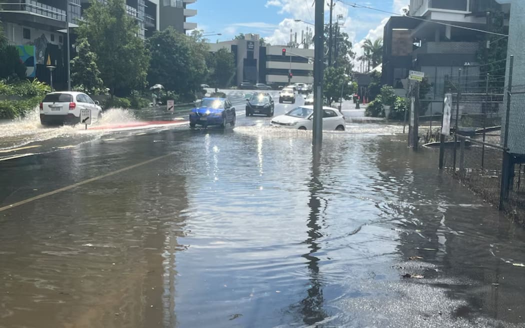 The short burst of heavy rain caused flooding in parts of Brisbane, including Woolloongabba.