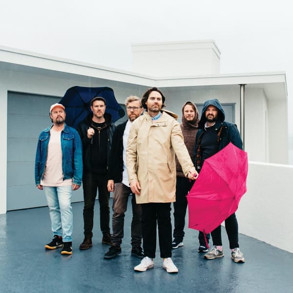 Phoenix Foundation 2023, left to right: Conrad Wedde, Tom Callwood, Chris O'Connor, Samuel Scott (with umbrella), Will Ricketts, Luke Buda.
