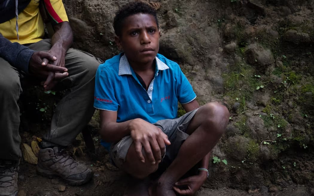 This boy goes into tribal battles to assist older soldiers.