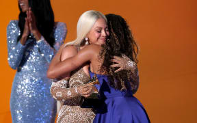 LOS ANGELES, CALIFORNIA - FEBRUARY 02: (FOR EDITORIAL USE ONLY) Beyonce accepts the Album of the Year for “Cowboy Carter” with Blue Ivy Carter onstage during the 67th GRAMMY Awards at Crypto.com Arena on February 02, 2025 in Los Angeles, California.   Amy Sussman/Getty Images/AFP (Photo by Amy Sussman / GETTY IMAGES NORTH AMERICA / Getty Images via AFP)