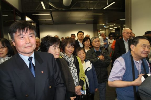 Audience listen to speeches at book launch