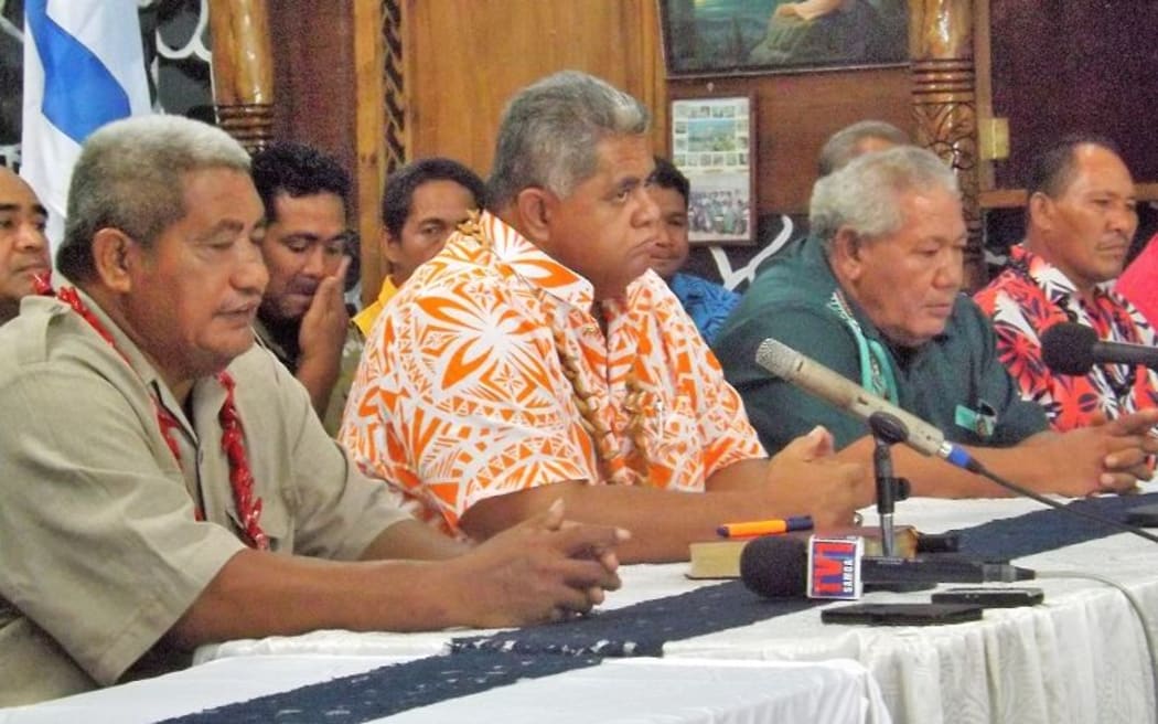 Laauli, centre, alongside members of the Gagaifomuga number 3 constituency