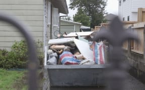 Some Māngere streets' skip bins are full of discarded items after flooding in Auckland.