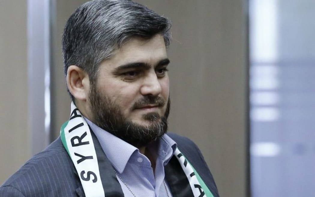 Mohammed Alloush has resigned over what he called the failure of peace talks.
