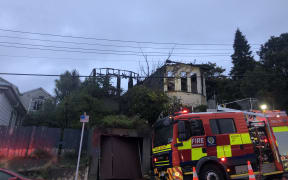 A fire truck outside a house on Hanson St, Newtown, gutted by fire.