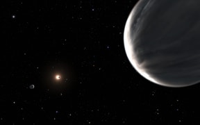 In this illustration, exoplanet Kepler-138 d is in the foreground and Kepler-138 c is on the left.