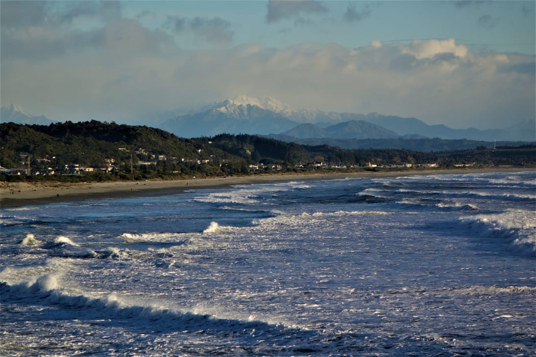 Southern Alps are seen behind Greymouth.