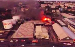 Value City and flea market in flames
