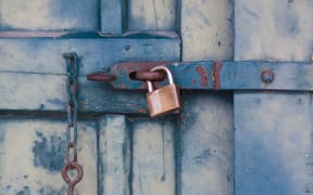 An image of a locked shipping container