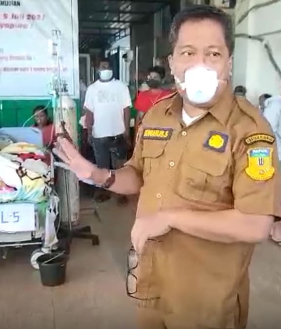 Papua provincial health spokesman Silvanus Sumule, outside a hospital in downtown Jayapura, explaining the strain on the health system from Covid-19. July 2021
