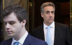 Michael Cohen, right,  leaves his apartment building in New York, Tuesday, May 14, 2024.  Cohen, former President Donald Trump’s fixer-turned-foe is returning to the witness stand for a bruising round of questioning from the former president’s lawyers. (AP Photo/Seth Wenig)