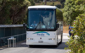 One of the buses used by evacuees leaving the quarantine zone at the Whangaparāoa base.