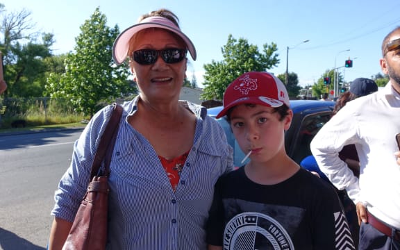Naila Fanene and her grandson at the protest.