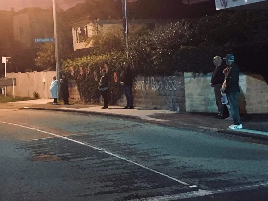People on Hillsborough Road in Auckland this on Anzac Day.
