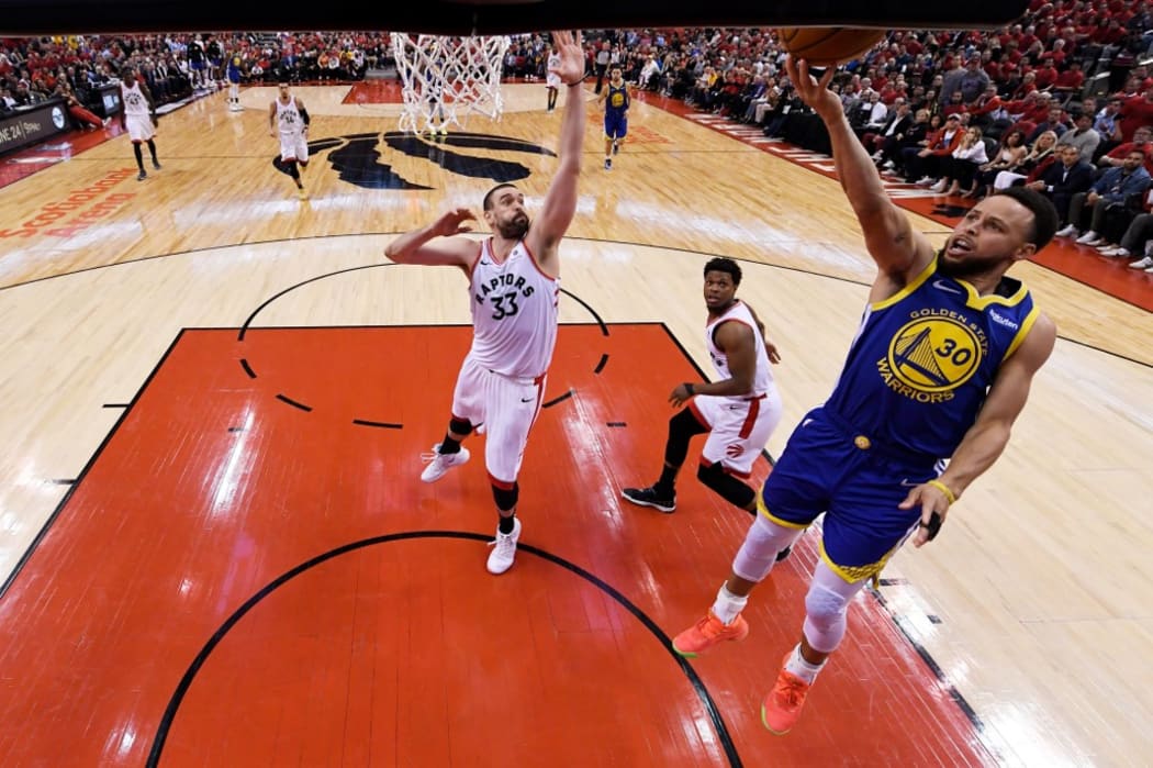 Stephen Curry #30 of the Golden State Warriors attempts a shot against Marc Gasol #33 of the Toronto Raptors during Game Two of the 2019 NBA Finals.