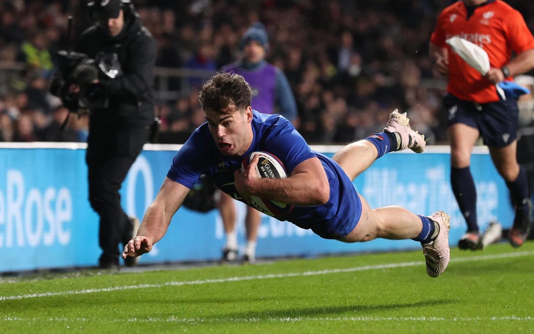 France’s Damian Penaud scores a try