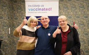 Residents Ellen Lund and Don and Ann Gibbon after getting their dose.