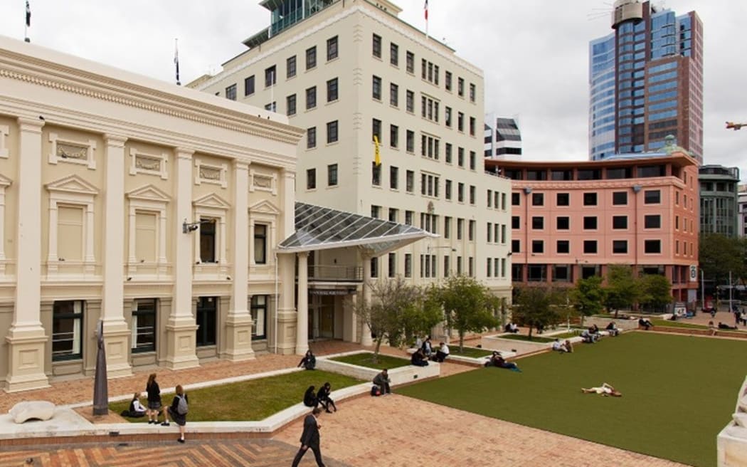 Wellington's Municipal Office Building (the tall cream coloured building in the middle) sits next to the Town Hall (left) in Te Ngākau Civic Square.