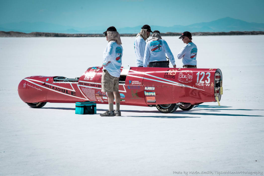 Eva's team prepares to race Killajoule at the salt flats
