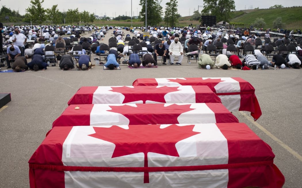 Mourners and supporters gather for a public funeral for members of the Afzaal family at the Islamic Centre of Southwest Ontario on June 12, 2021 in London, Canada.