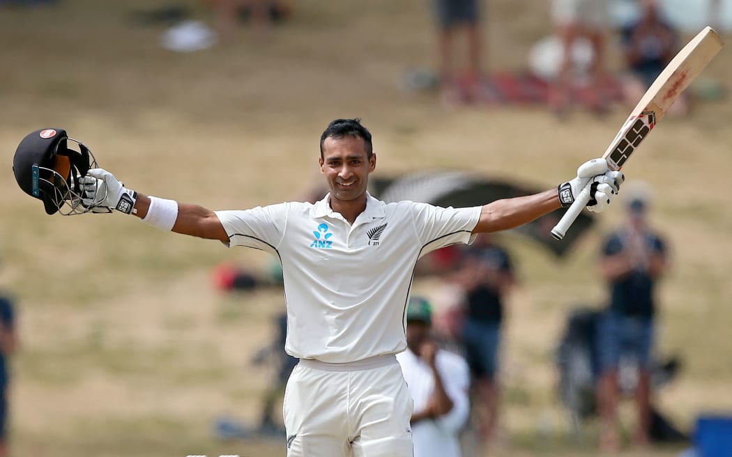 New Zealand's Jeet Raval celebrates his maiden Test hundred.