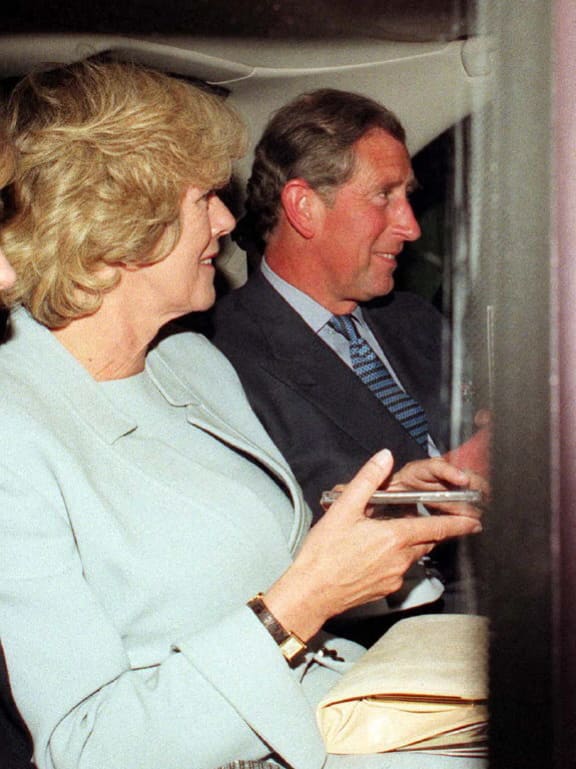 Prince Charles (R) and partner Camilla Parker Bowles (L) stepped out in public together this Thursday night, 06 May 1999, their third outing in nine days. The couple's night out at the Royal Festival Hall to attended a concert by the Philharmonia Orchestra, featuring a recital by Evgeny Kissin of Rachmaninov's Piano Concerto No 2. (Photo by JUSTIN WILLIAMS / PRESS ASSOCIATION / AFP)