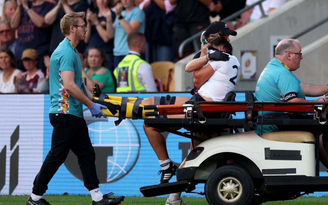 Kaipo Olsen-Baker reacts to an injury as she is driven off of the field during the Women’s Rugby World Cup pool C match between New Zealand and Spain at York Community Stadium, York, northern England, on August 24, 2025.