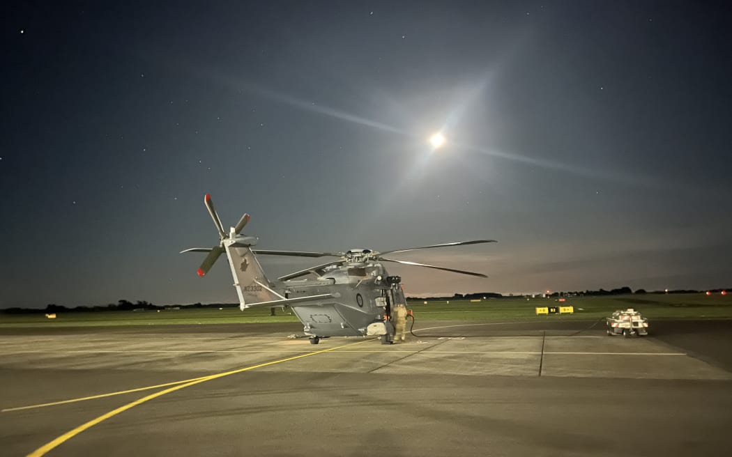 The Royal New Zealand Air Force deployed a helicopter to rescue a freezing tramper and his dog in the Tararua Ranges north of Wellington.