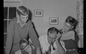 Mr M A Watts with his sons filling in census forms, 1956. Evening Post newspaper