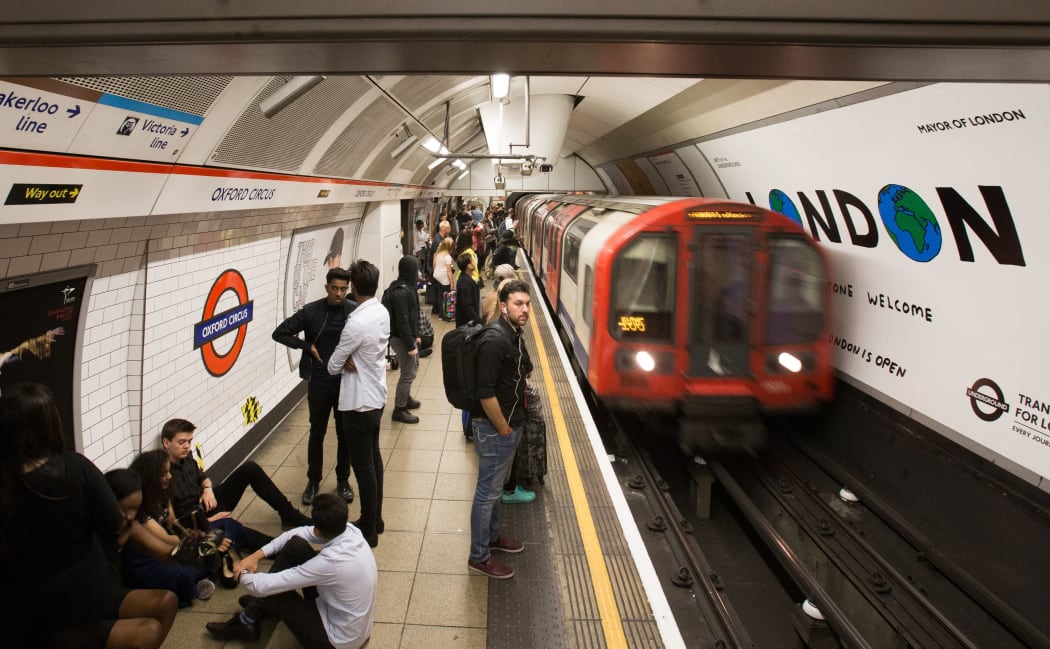A London Underground train arrives at Oxford Circus station in central London on August 20, 2016, following the launch of the 24 hour night tube service. - The Night Tube