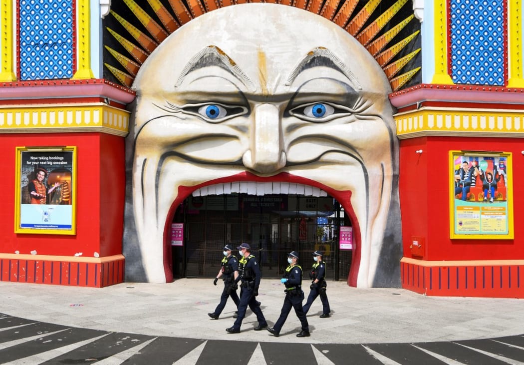 Police patrol at Luna Park in Melbourne on 25 September during an anti-lockdown rally.