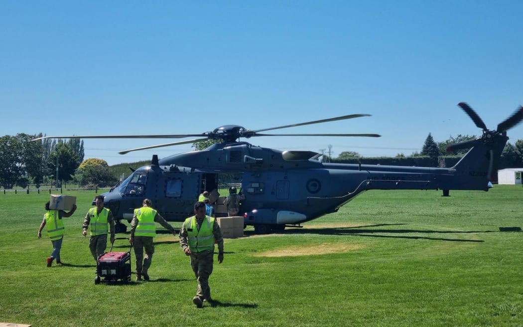 The Hastings' Tomoana Showgrounds has been transformed into a regional distribution hub for volunteers, Civil Defence staff, and military personnel to sort through donated clothing, food, and other supplies.