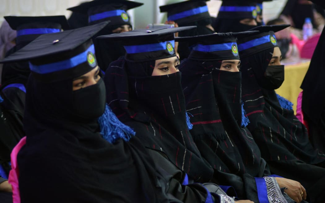 Students from the faculties of engineering and computer science attend their graduation ceremony at the Benawa University in Kandahar on 17 March, 2022.