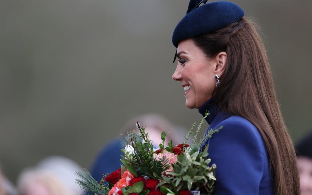 Britain's Catherine, Princess of Wales chats with well-wishers after attending the Royal Family's traditional Christmas Day service at St Mary Magdalene Church on the Sandringham Estate in eastern England, on December 25, 2023. (Photo by Adrian DENNIS / AFP)