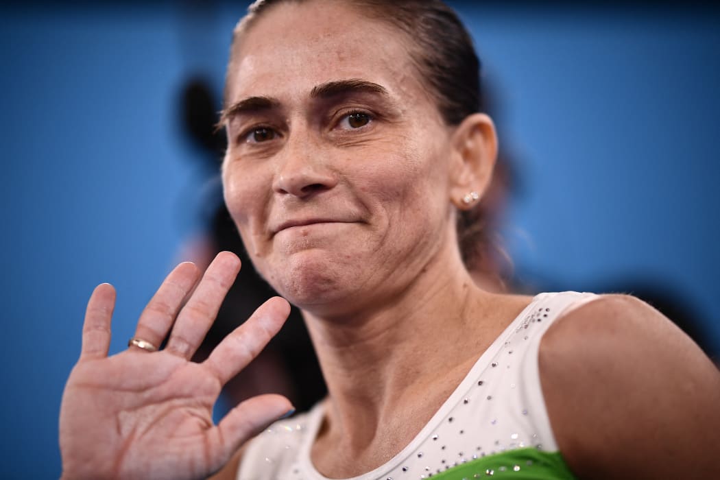 Uzbekistan's Oksana Chusovitina reacts after competing in the artistic gymnastics vault event of the women's qualification during the Tokyo 2020 Olympic Games at the Ariake Gymnastics Centre in Tokyo on 25 July , 2021.