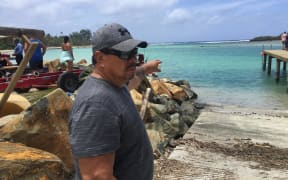 Cook Islands MP Tamaiva Tuavera points to where he rescued the three girls