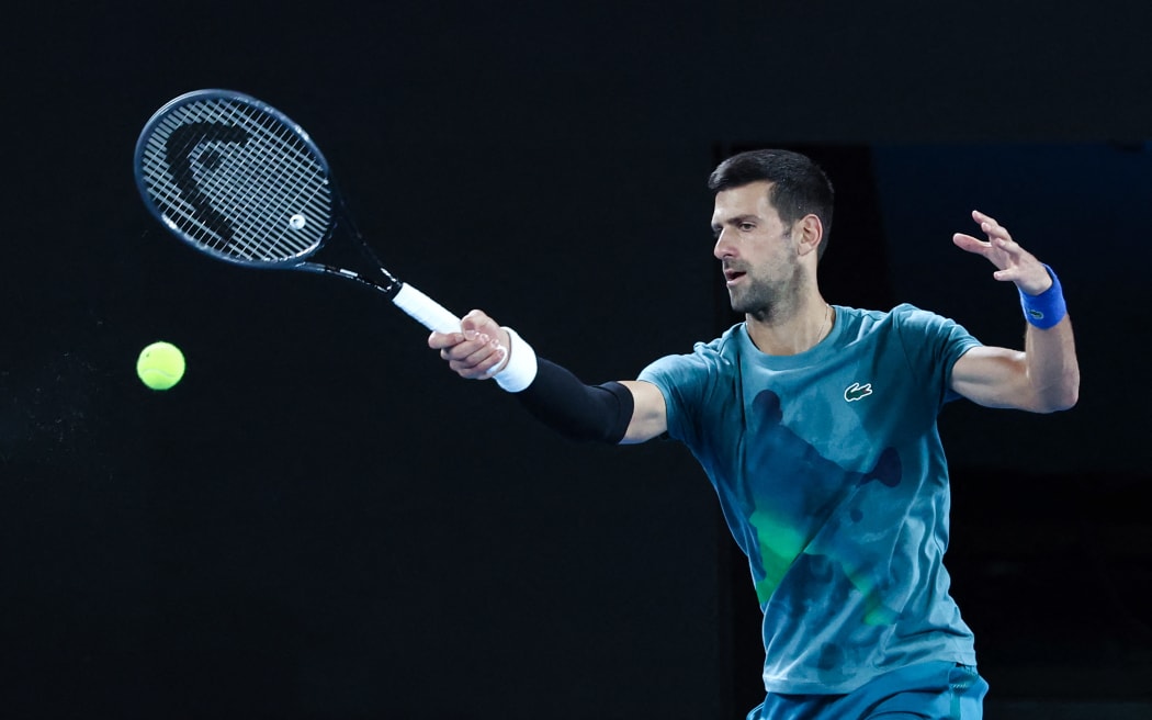 Serbia's Novak Djokovic hits a return during a practice session in Melbourne on January 13, 2024 ahead of the Australian Open tennis championship starting on January 14.