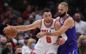 Zach LaVine #8 of the Chicago Bulls moves against Evan Fournier #13 of the New York Knicks at the United Centre on October 28.