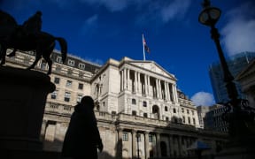 A man walks past the Bank of England in London, United Kingdom on November 3, 2022.