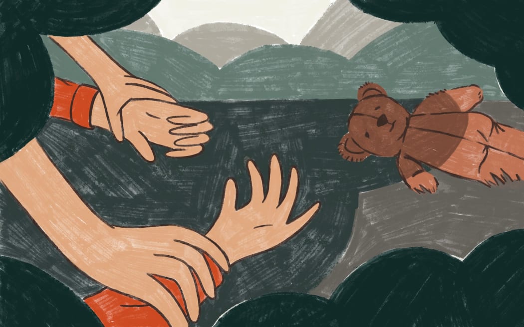 Hands forcefully holding down person's wrists.