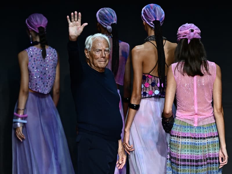 Italian designer Giorgio Armani waves from the runway of the Emporio Armani fashion show during the Milan Fashion Week Womenswear Spring/Summer 2024 on September 21, 2023 in Milan. Italian fashion great Giorgio Armani has died at the age of 91 "surrounded by his loved ones", his company said on September 4, 2025. (Photo by GABRIEL BOUYS / AFP)