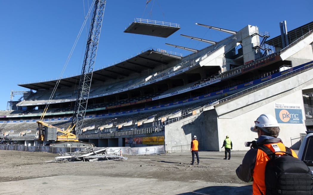 Another roof panel comes off the Paul Kelly stand at Christchurch's Lancaster Park.