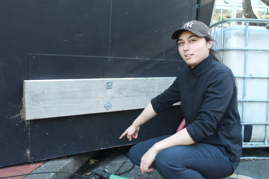 Sushi Bi worker Wini Morris shows where the penguins made their shelter.