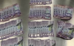 Money seized from police in relation to an alleged blessing scam.