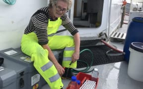 Dr. Kim Currie gets ready to collect another water sample.