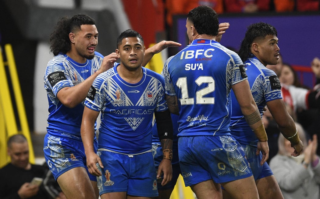 Samoa's Brian To'o celebrates after scoring the team's first try during the Rugby League World Cup Men's final between Australia and Samoa at Old Trafford stadium, in Manchester