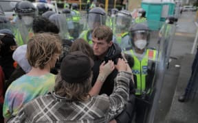 Protesters clash with police on day 23 of the occupation.