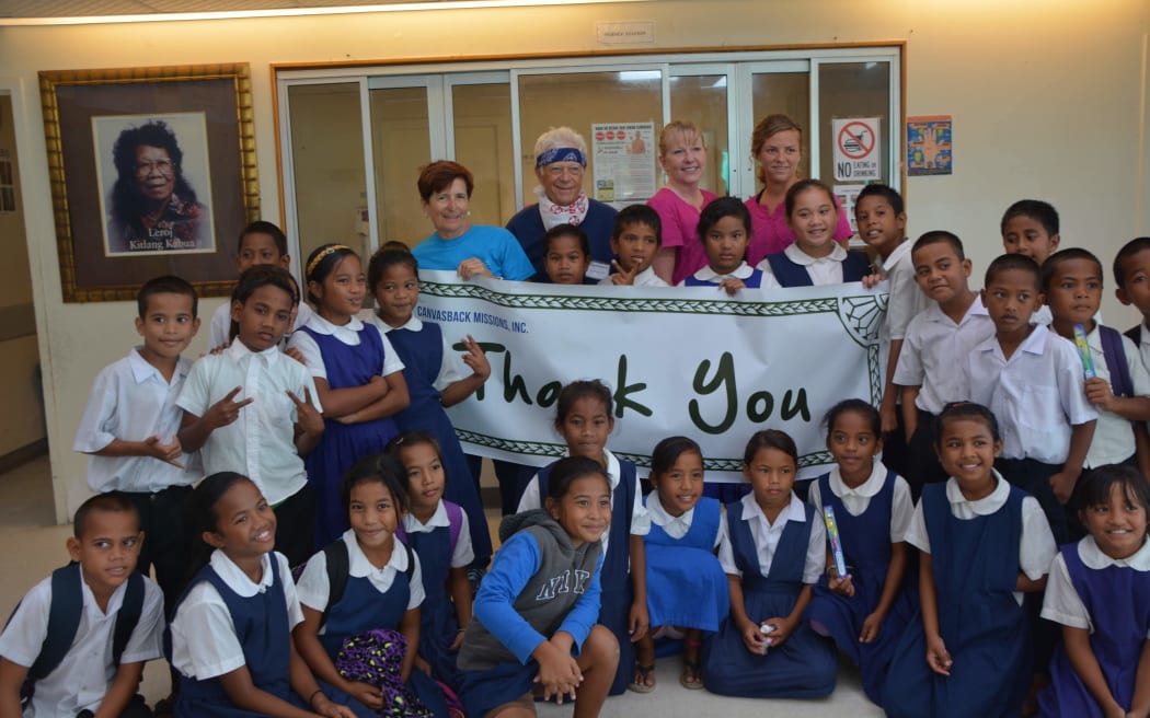 The Canvasback dental team with Ebeye students